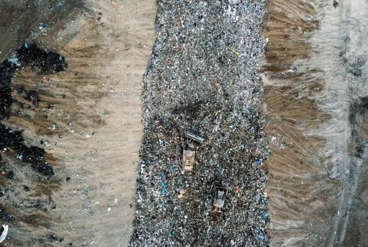 Landfill with garbage and glass